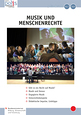 Die Umschlagseite enthält zwei Bilder: Auf dem unteren Bild sitzen und stehen etwa 50 Kinder auf einer Bühne. Vor ihnen steht ein Mann am Klavier. Auf dem oberen Bild wenden sich die Kinder einer großen Leinwand mit weiteren Kindern zu.